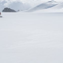 A vehicle traverses across Pine Island Glacier on the West Antarctic Ice Sheet. 