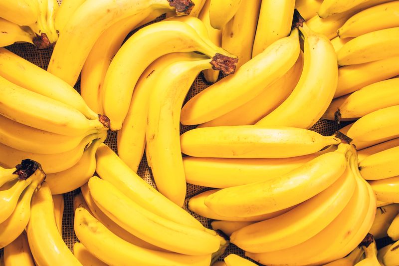 Several bunches of bananas on jute fabric
