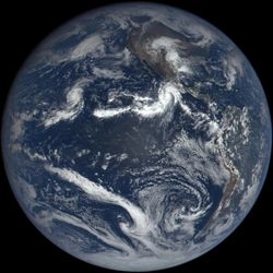 An image of the Earth's globe focusing on the Americas and the pacific showing a A hurricane like storm near mexico