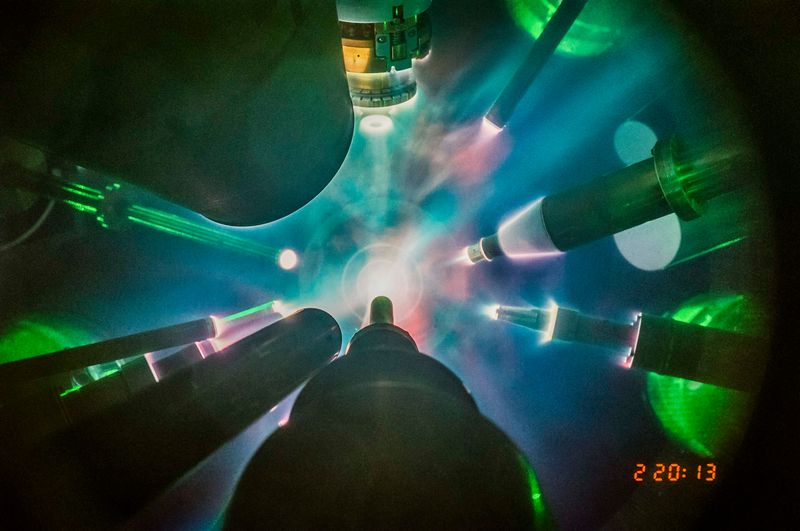 Several instruments are seen pointing towards a center where a bright light is forming