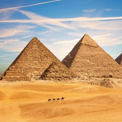 the complex of giza seeing during the day. The three main pyramids and the smaller ones are all visible