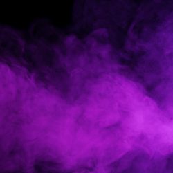 Purple smoke drifting on a black background, looking moody and dramatic 