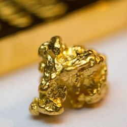 Close-up of a gold-bar and gold-nugget