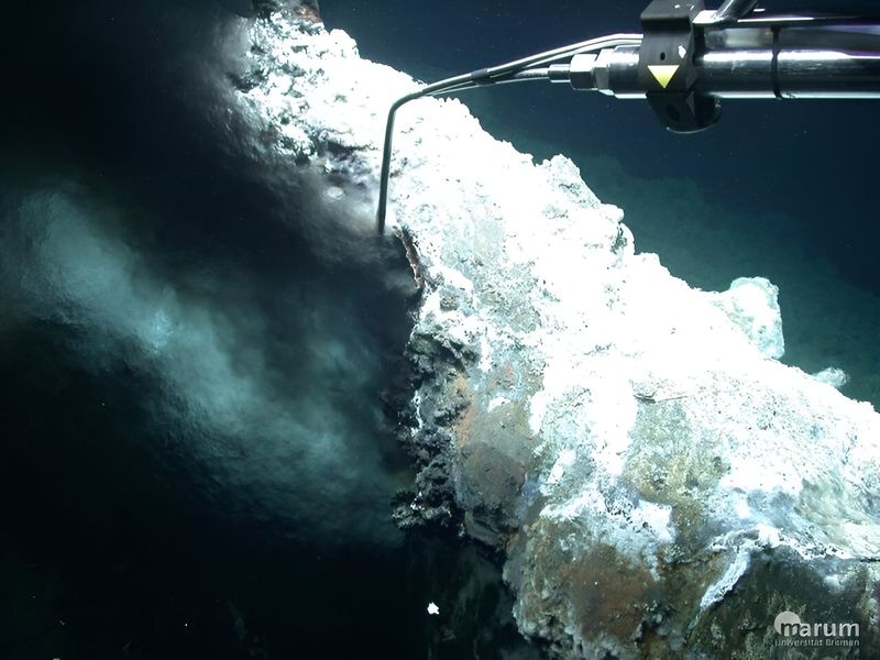 Fluids gush out of a "black smoker" at the Jotul hydrothermal field.