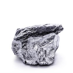 Iridium piece on a white background its grey and shiny.