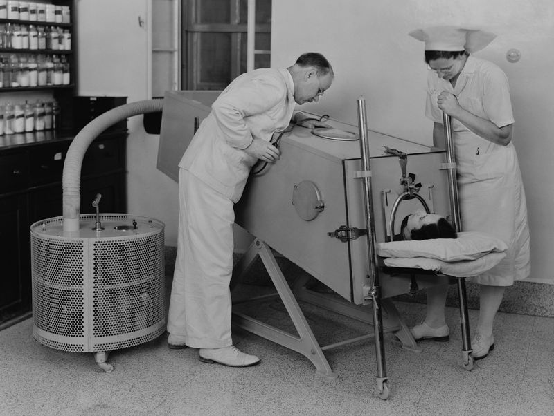 patient on iron lung in the 1940s in a hospital in Palestine