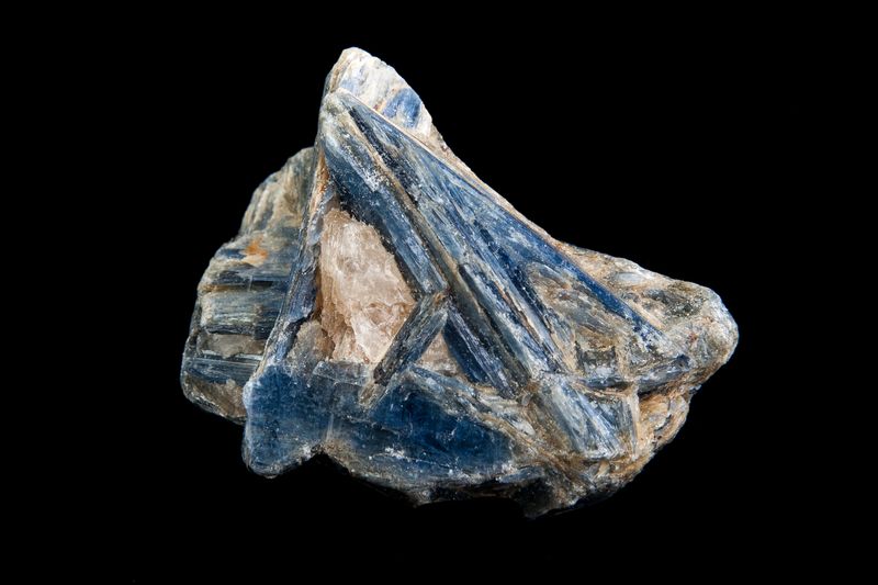 Kyanite crystal specimen isolated on a black background