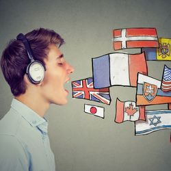 man wearing headphones with mouth open as if speaking, with illustrated flags from different nations to represent multiple languages