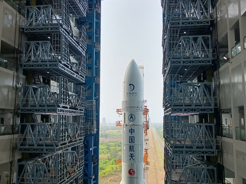 An image of the top part of a rocket leaving a building