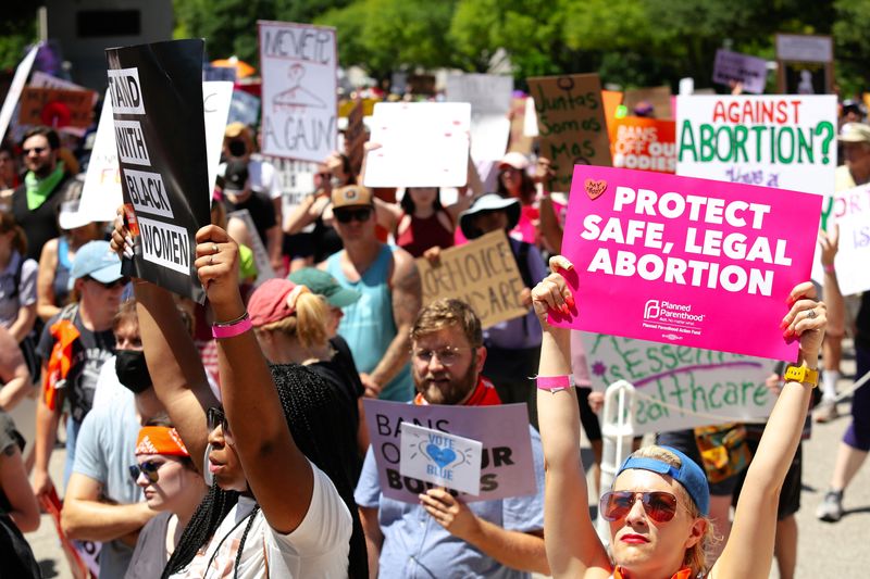 pro-choice protestors holding signs with slogans such as "protect safe, legal abortion" in Austin, Texas, photographed May 14, 2022