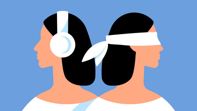 cartoon depictions of two females stood back to back, one wearing white headphones, the other wearing a white blindfold, against a blue background