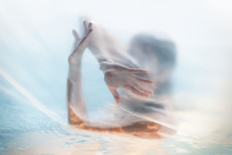 Shower curtain sticky to a woman