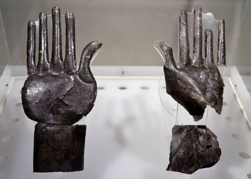 A display of the two silver hands found at the site in Vulci, Italy