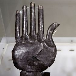 A display of the two silver hands found at the site in Vulci, Italy