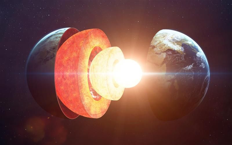 A digital representation showing the planet separated into its constituent parts, like different sized hollow spheres fitting inside one another. At the centre is the glowing super-hot core. 