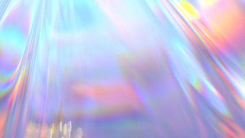 A photo of a holographic plastic creating many rainbows