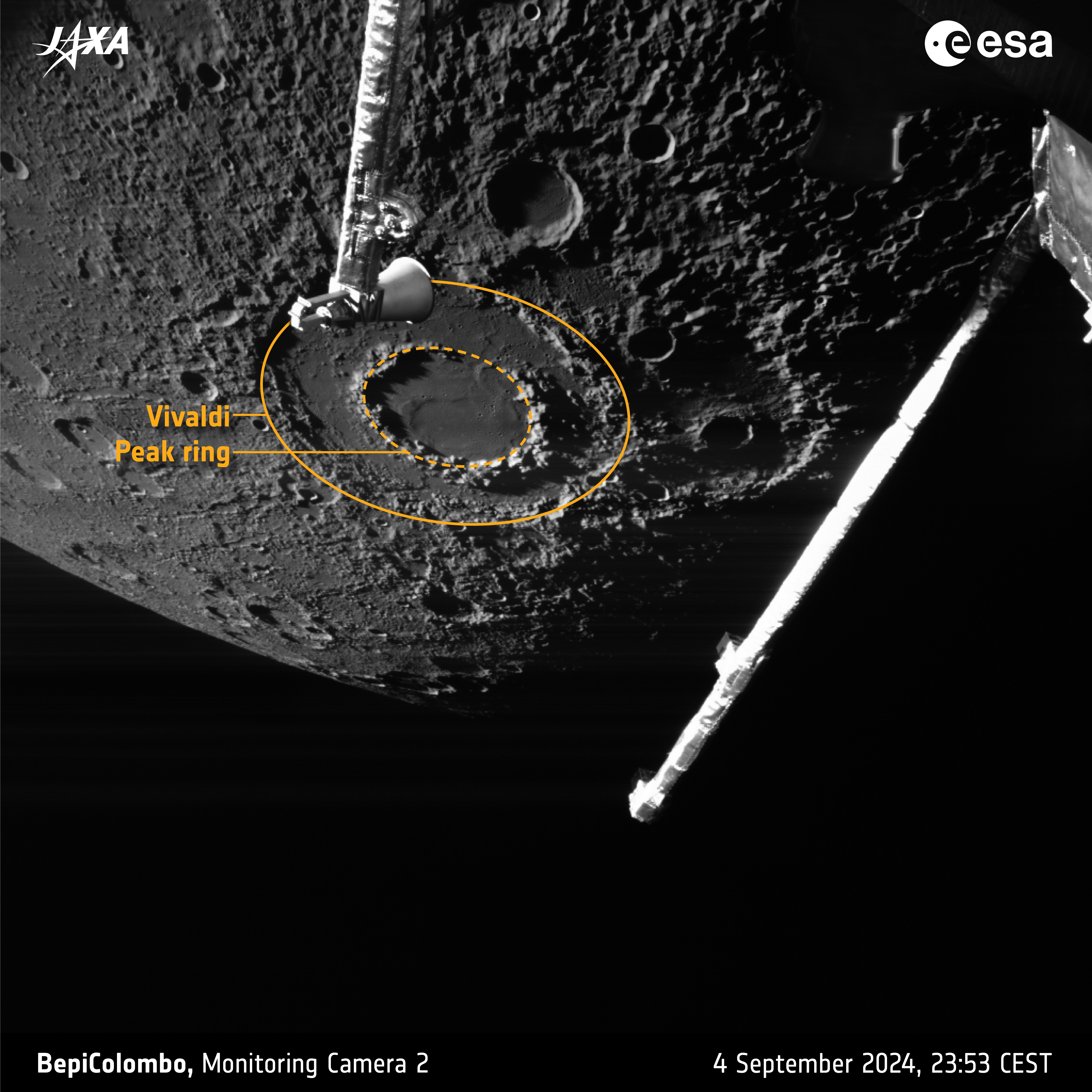 Planet Mercury in the background with its grey, cratered, pock-marked surface. In the foreground are some spacecraft parts. The main focus is a crater with a double rim looking like a flat donut. Planet Mercury in the background with its grey, cratered, pock-marked surface. In the foreground are some spacecraft parts. The main focus is a crater with a double rim looking like a flat donut.