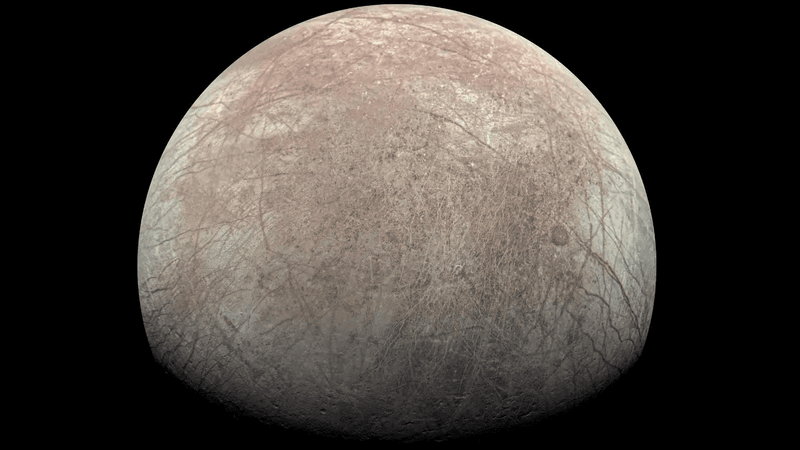 An image of Europa. Many groves are visible in the icy surface