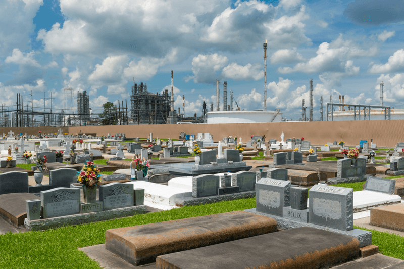 A petrochemical plant over looks a cemetery in Taft, Louisiana.