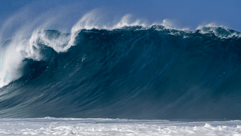 a huge wave or tsunami making ground