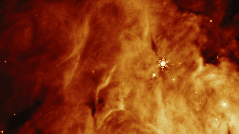 An orange cloud is visible with a handul of stellar objects appearing within it.