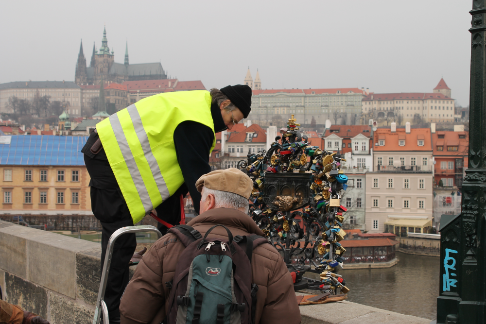 love locks being removed from a bridge in prague love locks being removed from a bridge in prague