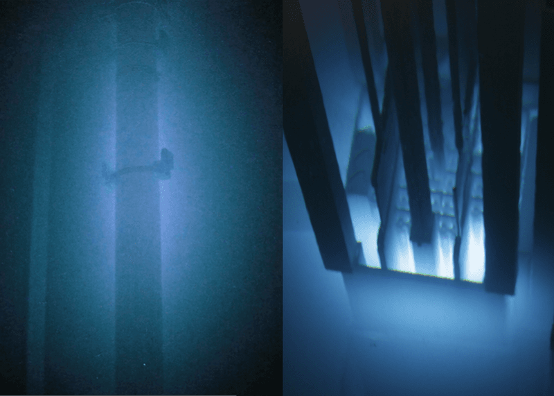Tubes submersed in water are glowing due to cherenkov radiation.