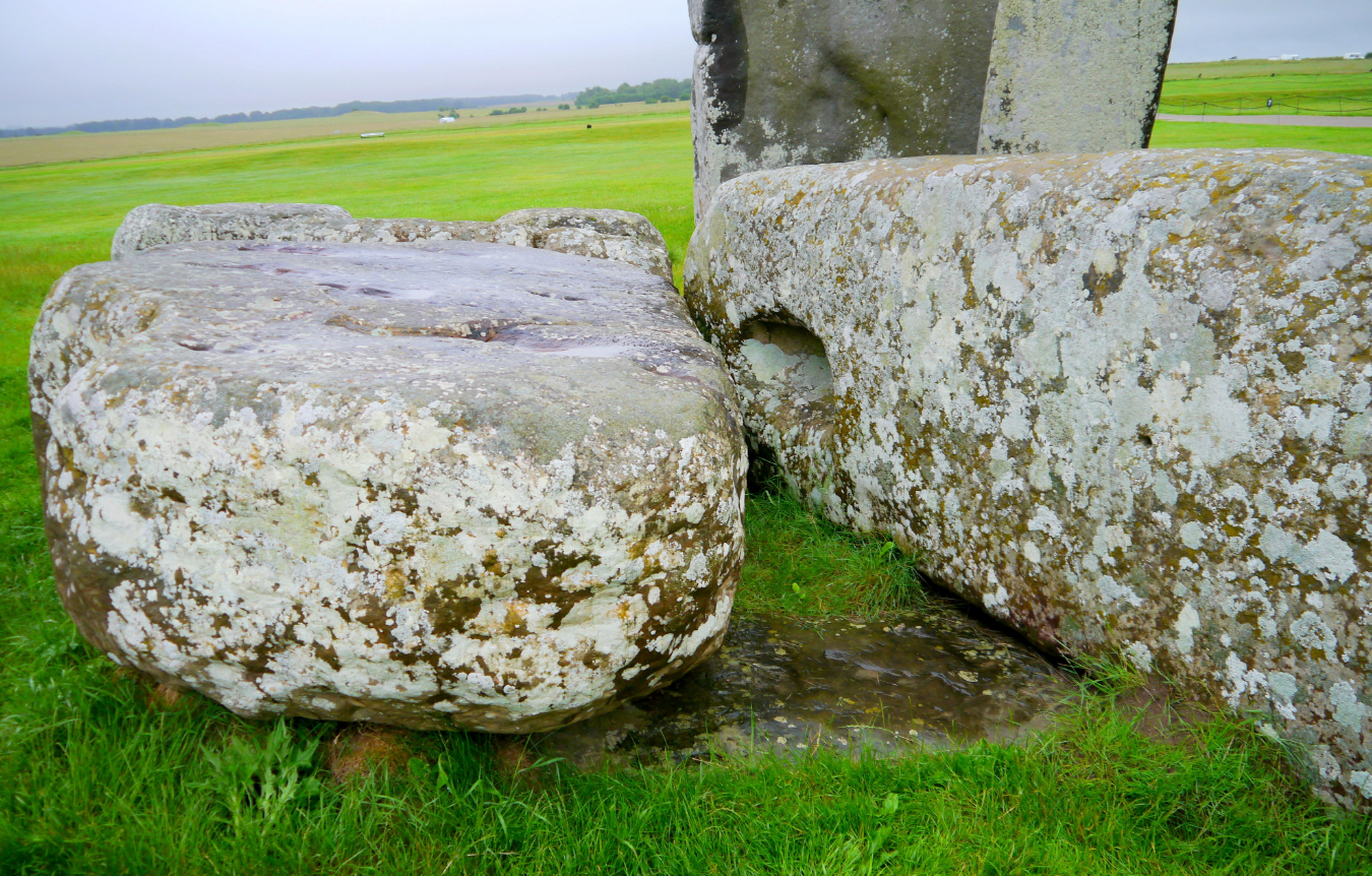Stonehenge Altar Stone, seen here underneath two bigger Sarsen stones.  