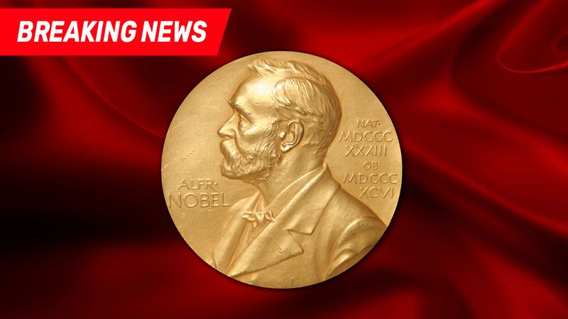 The breaking news banner and the nobel medal over a velvet background