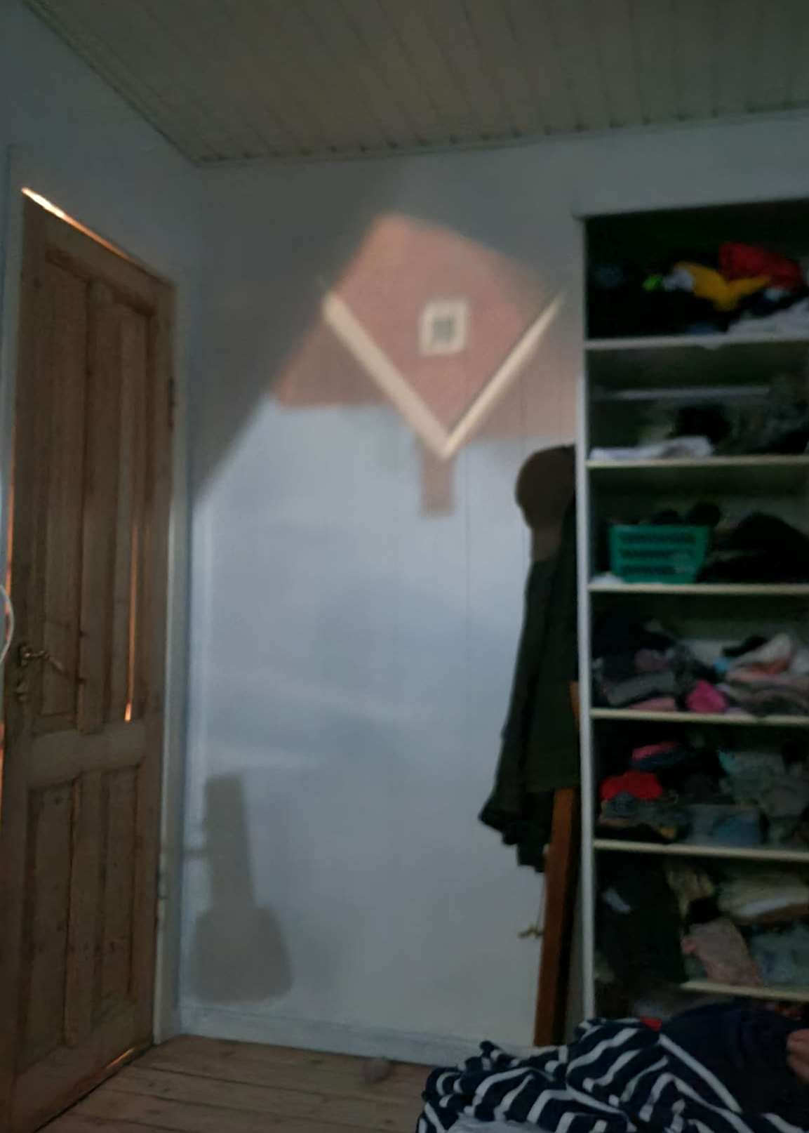 A house projected onto a bedroom wall.