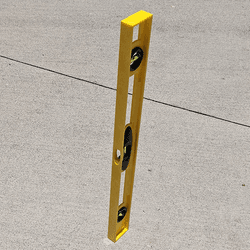 A level standing vertically and not casting a shadow